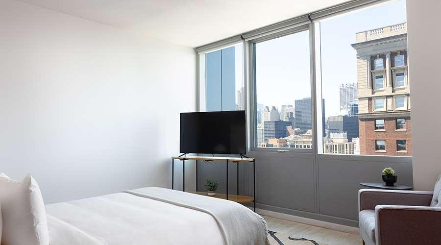 Sentral Michigan Avenue Aparthotel Chicago Room photo A bedroom at 100 East 14th Street
